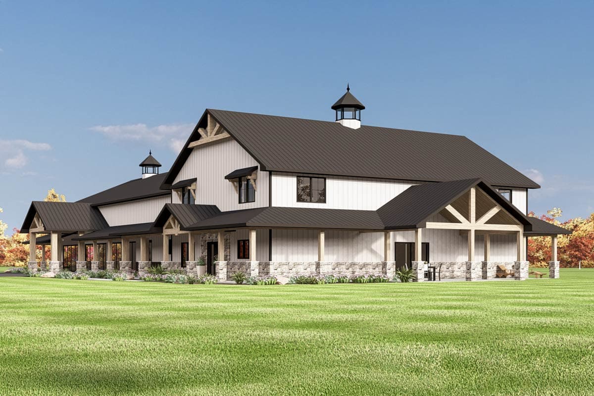 House plan exterior rendering of a large, two-story Modern Farmhouse with a wraparound porch, gables, and stone accents.