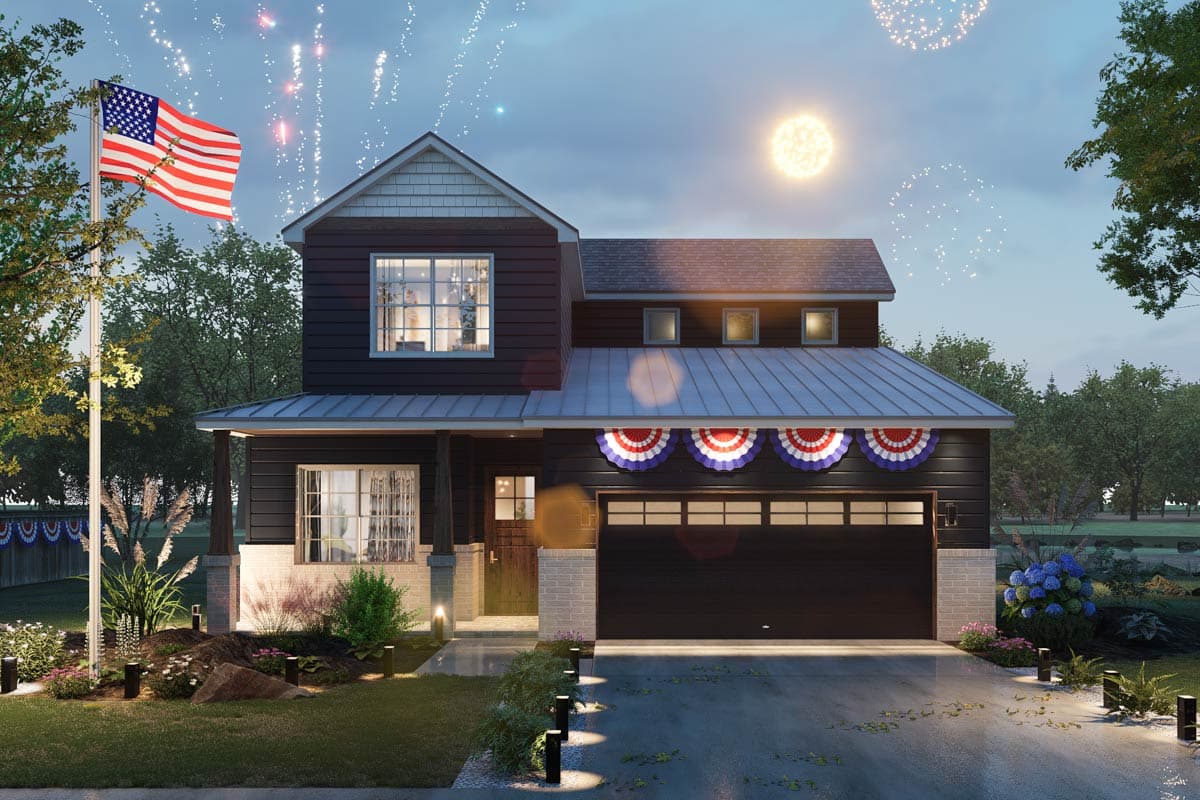 Two-story house plan exterior with a metal roof, gables, covered porch, and a two-car garage. Features patriotic decorations.