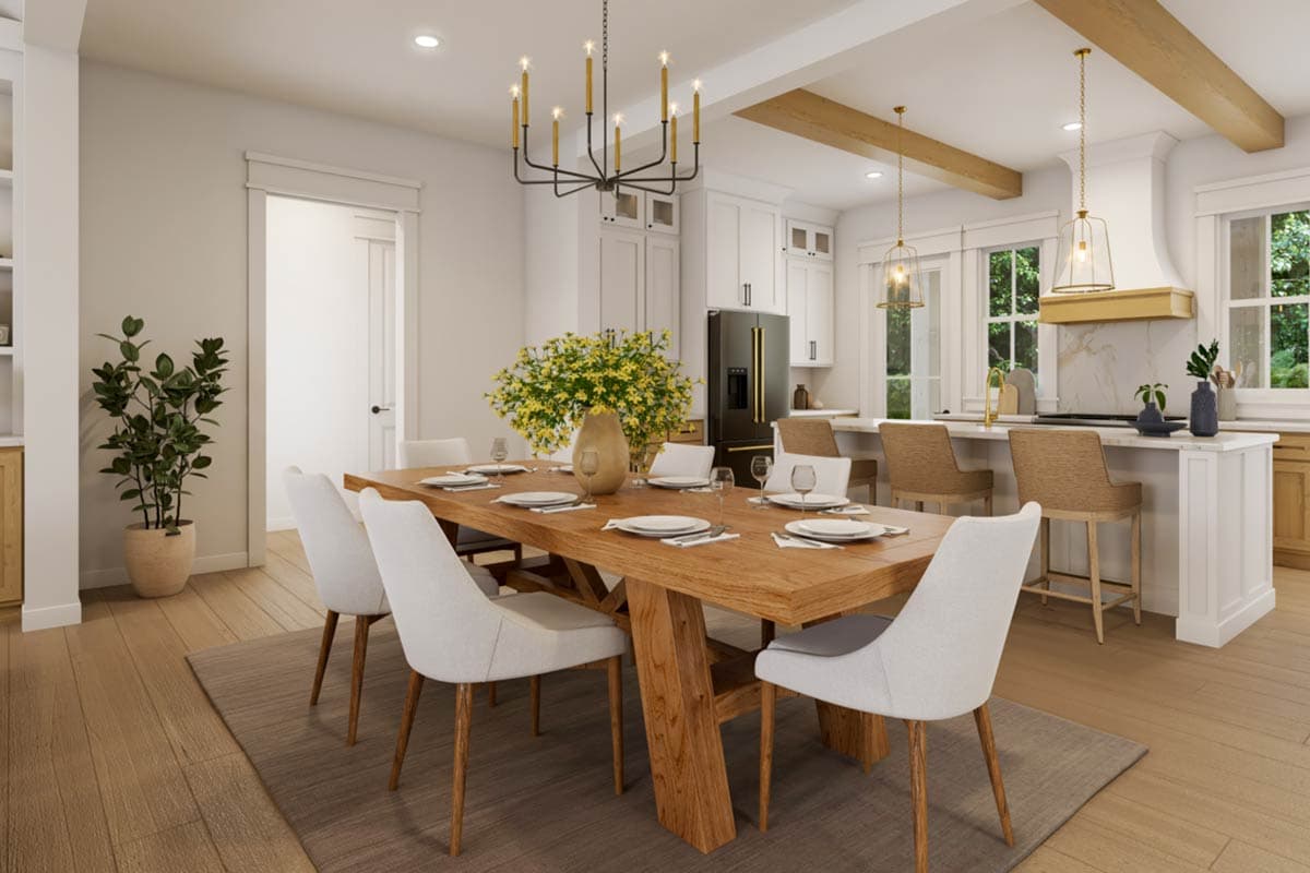 Interior rendering of dining room and kitchen with island seating, wood table, and pendant lighting.