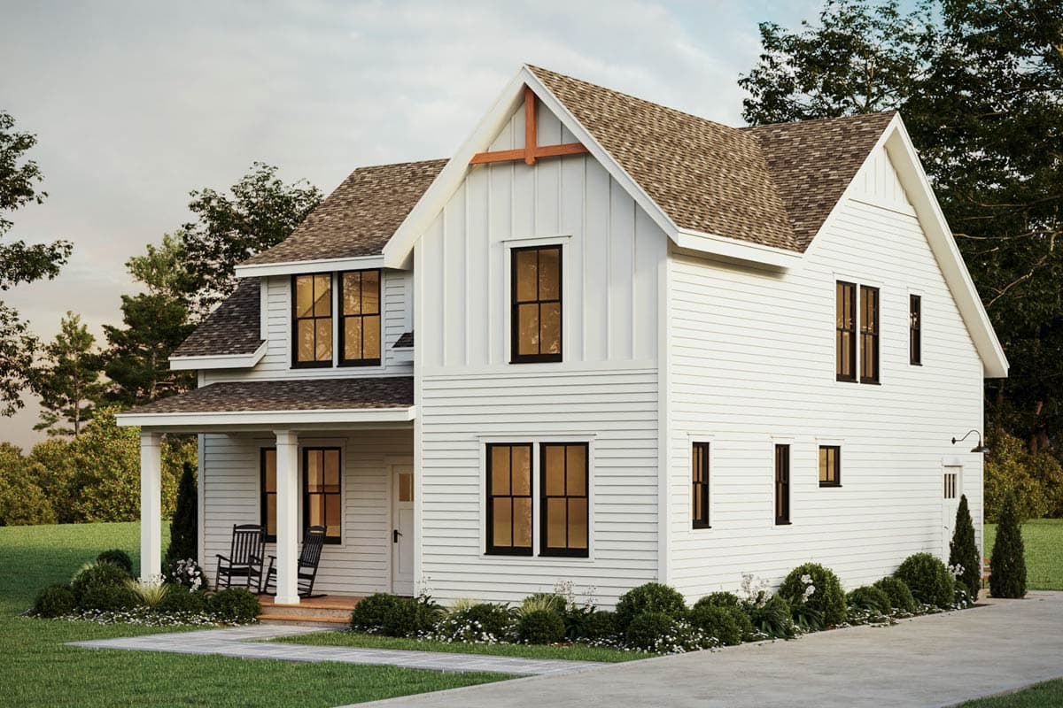Modern Farmhouse style house plan exterior. Two stories, white siding, prominent gables, covered porch, and dark-framed windows.