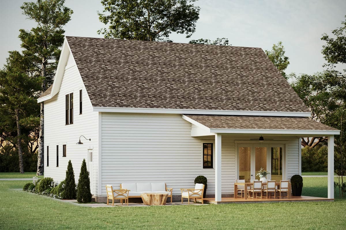 Two-story Modern Farmhouse exterior with a prominent gable, white siding, and covered rear porch with outdoor dining.