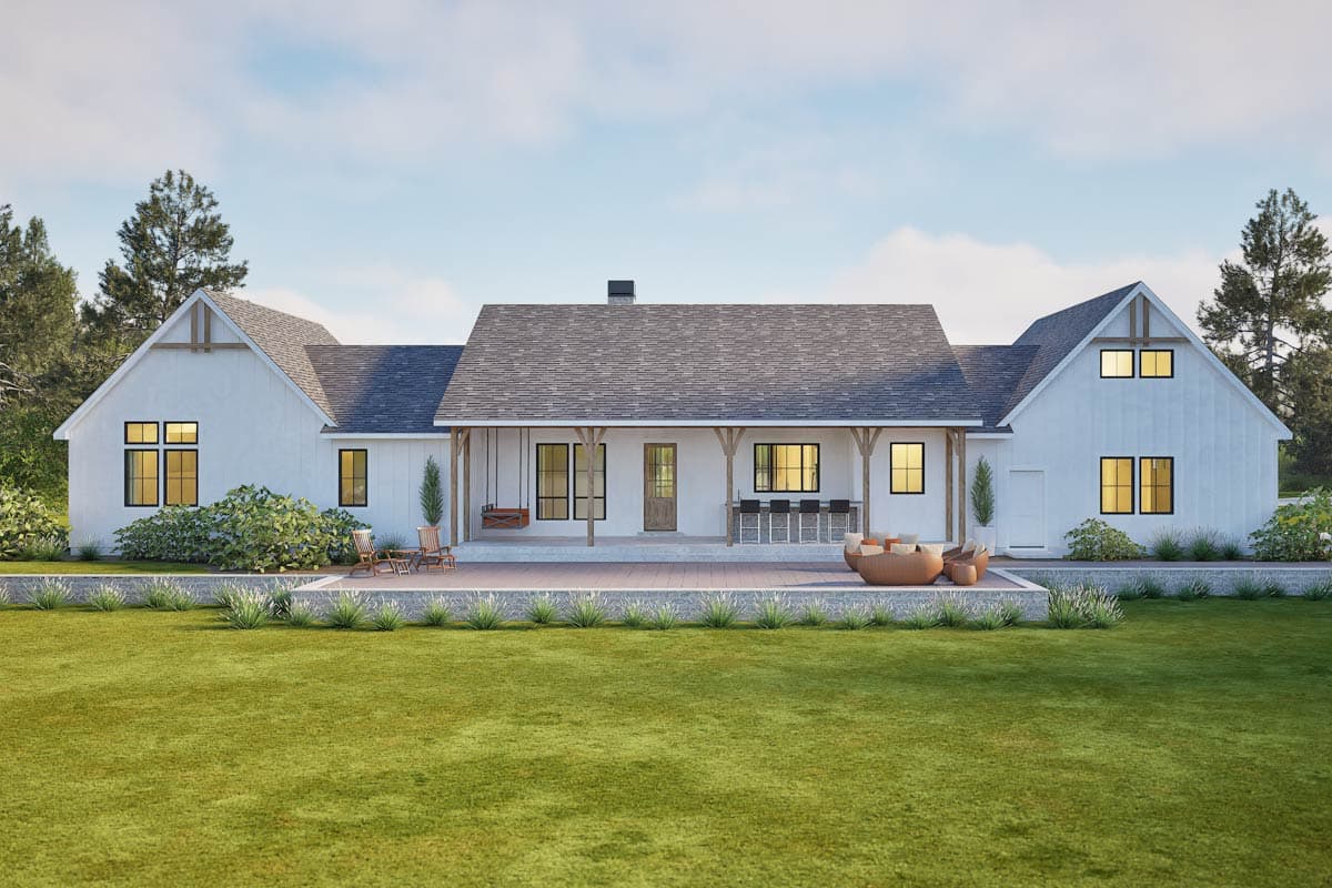 Modern Farmhouse house plan exterior with gables, covered porch with swing and outdoor bar, and a large patio.
