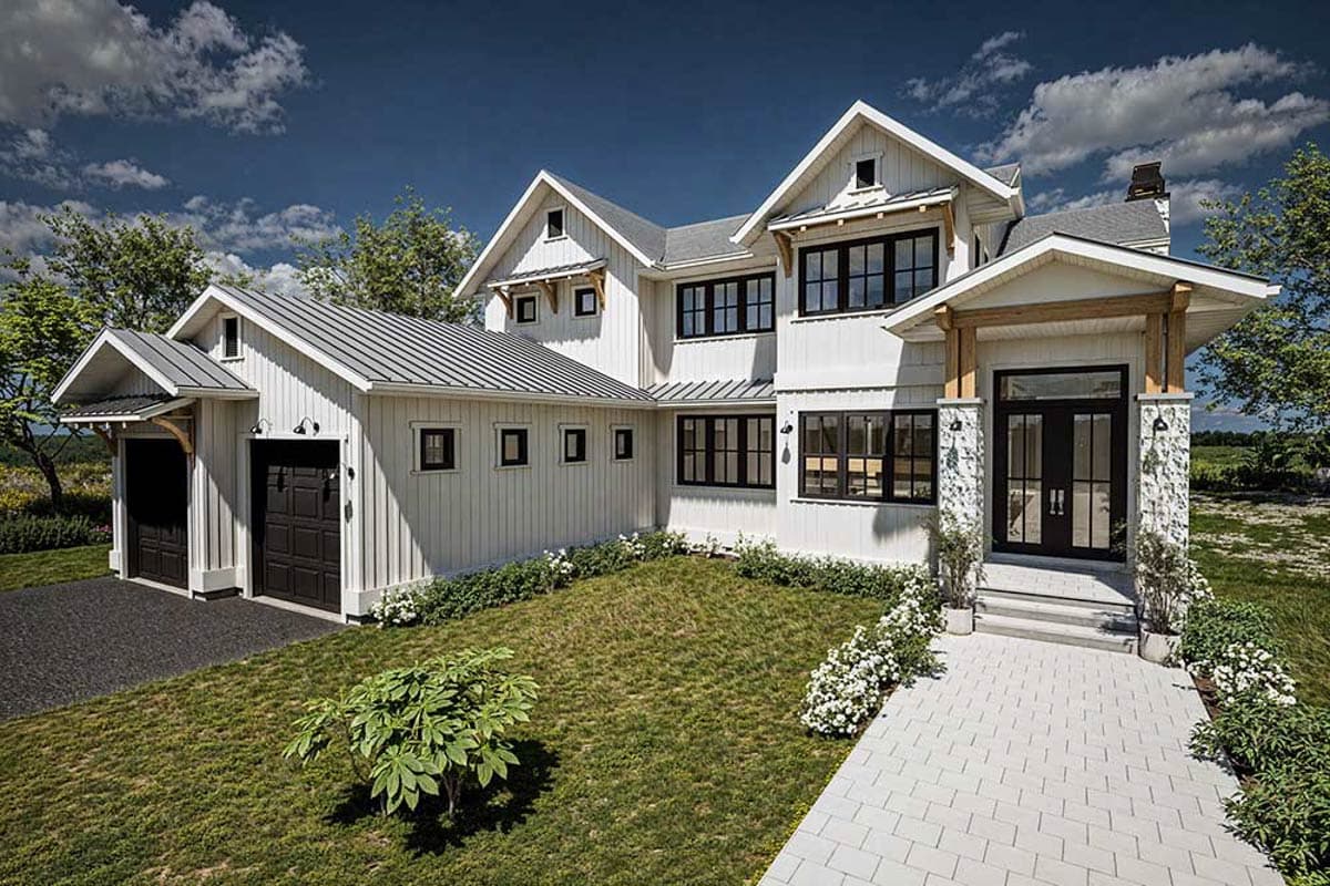 Modern Farmhouse house plan exterior with a metal roof, gabled dormers, stone accents, and a two-car garage.