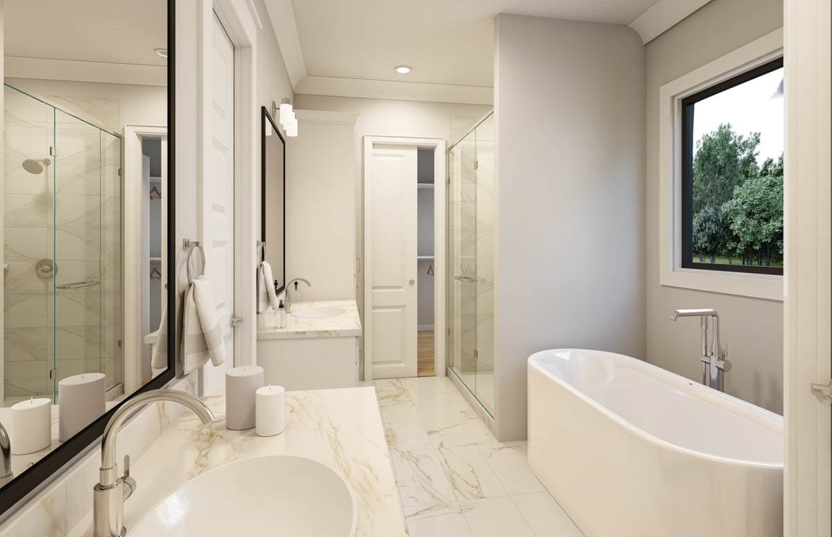 Luxurious bathroom with a modern white tub, marble counters, and a glass shower. The room is bright and airy.