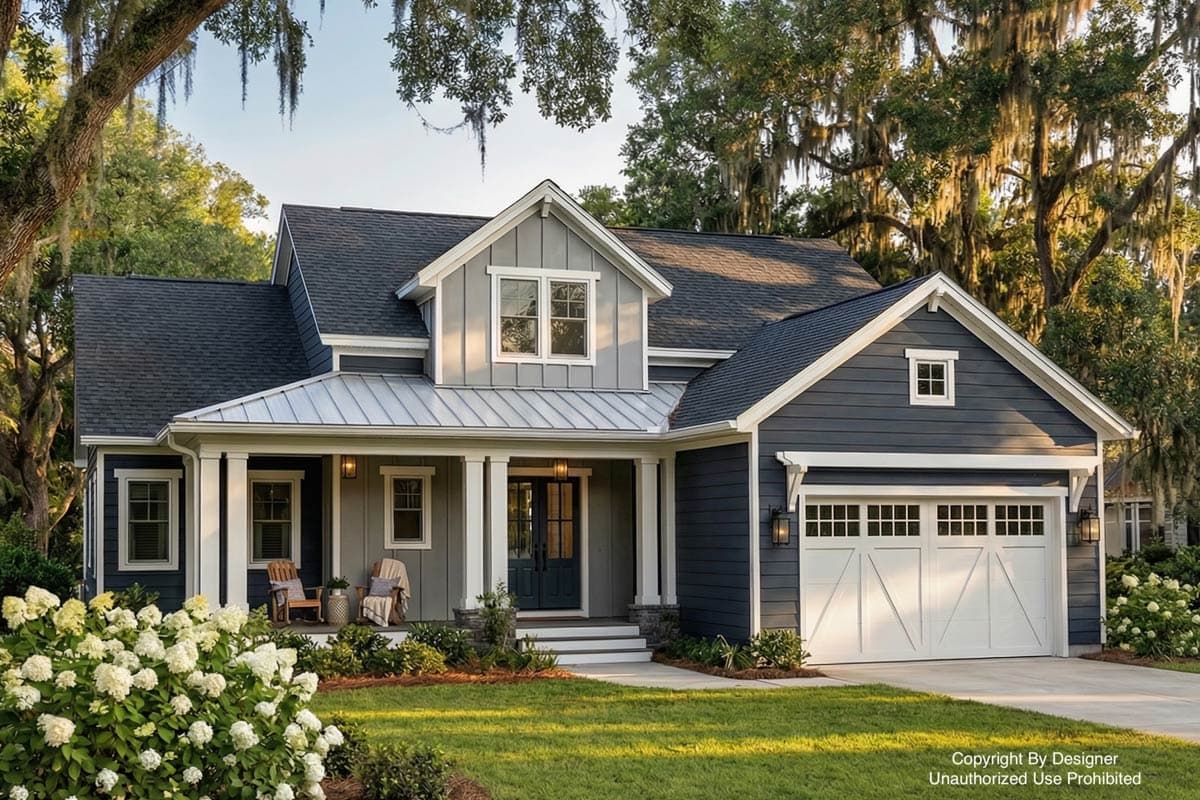 A two-story house with a blue exterior and white trim sits on a green lawn, shaded by trees with Spanish moss.