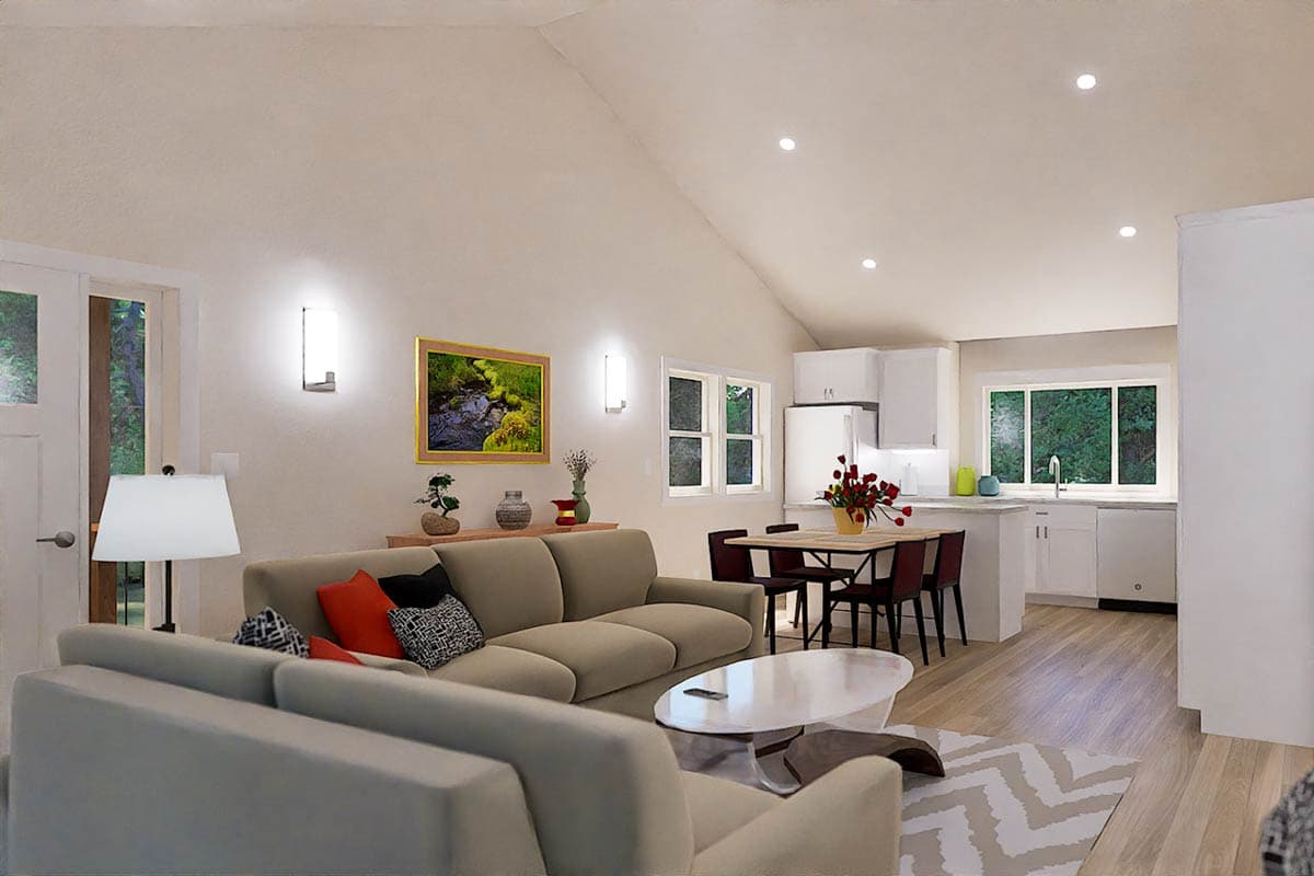 A modern, open-concept living space with a kitchen, dining area, and living room. Neutral colors and natural light create a cozy atmosphere.