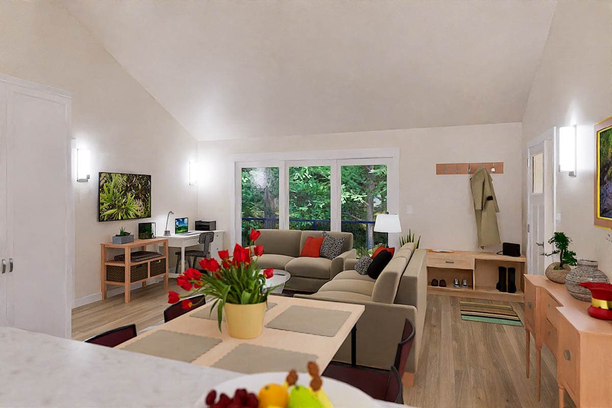 Bright, modern living room with a neutral color scheme. A large sectional sofa, work area, and dining table are present.  A view of the outdoors.