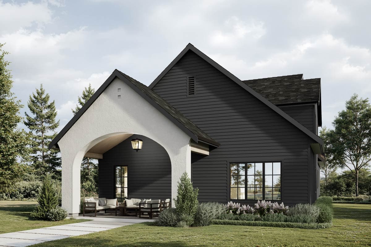 Modern Farmhouse house plan exterior with arched entryway, two stories, board and batten siding, and prominent gables.