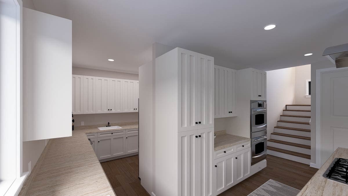 Kitchen interior with white shaker cabinets, double ovens, sink, and staircase access.