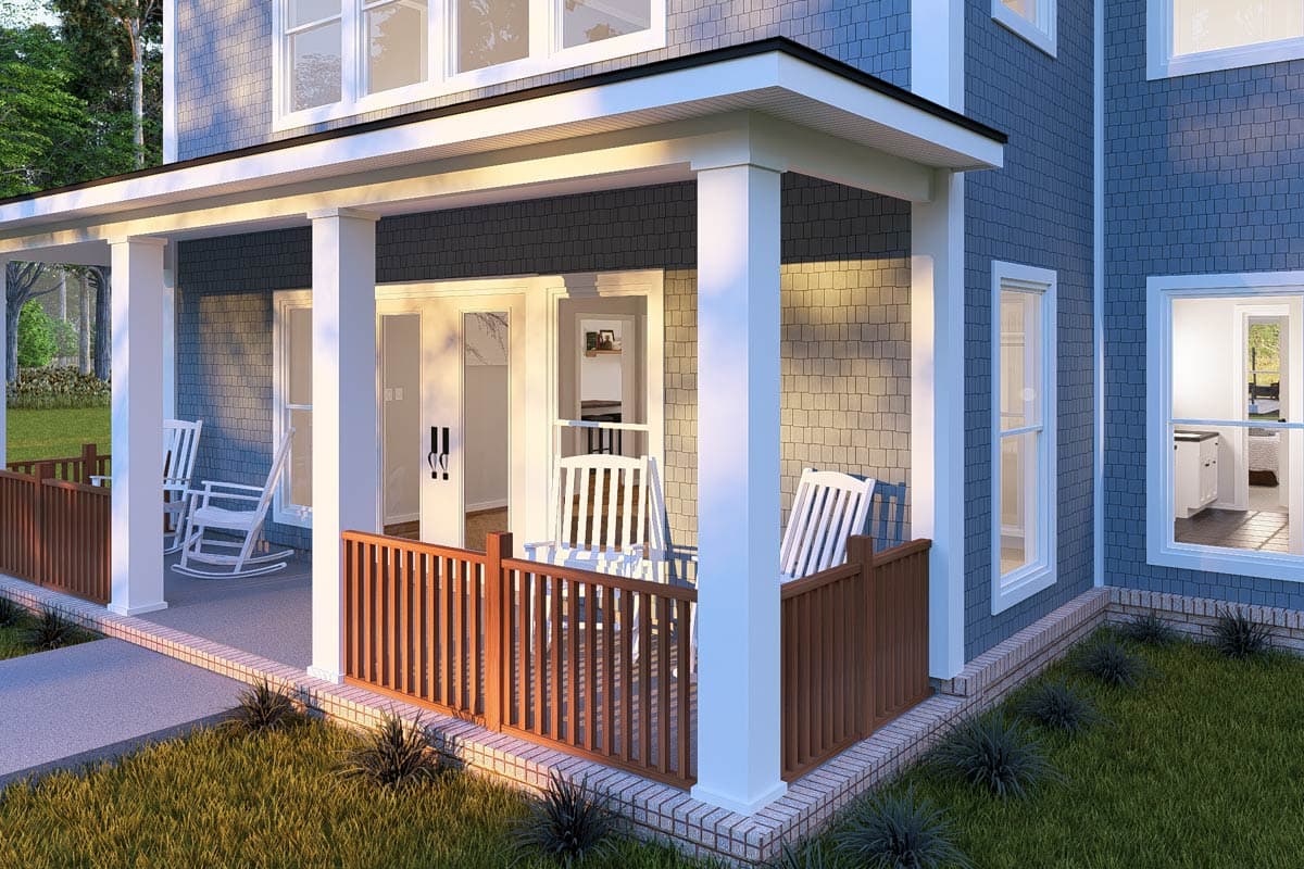 House plan exterior features a covered porch with white columns, wooden railings, and rocking chairs. Two-story structure with grey shingle siding.