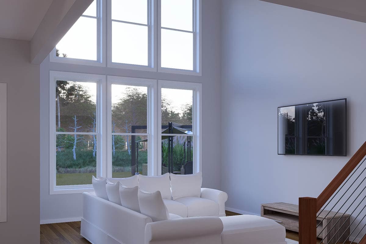 Interior rendering of a great room with a sectional sofa, vaulted ceiling, large windows, and a wall-mounted TV.