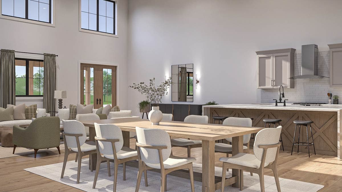 Open-concept living and dining area with vaulted ceiling, fireplace, and kitchen island.
