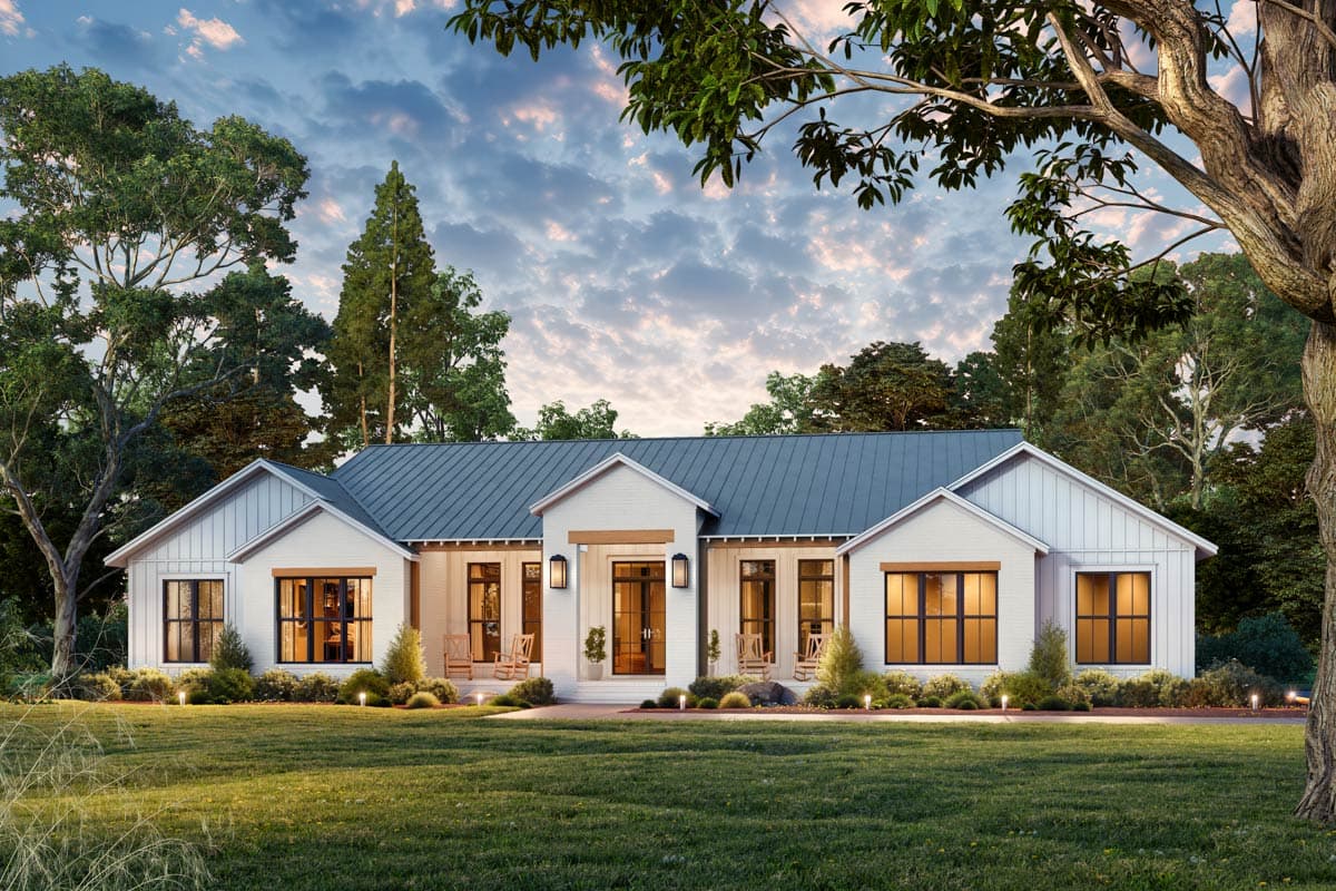Modern Farmhouse style house plan exterior with a low-pitched metal roof, gabled dormers, and a covered entry porch.