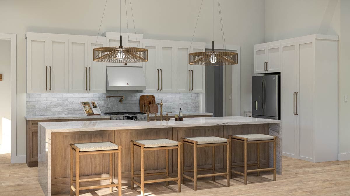 Kitchen with island, four bar stools, white shaker cabinets, subway tile backsplash, stainless steel appliances and pendant lights.
