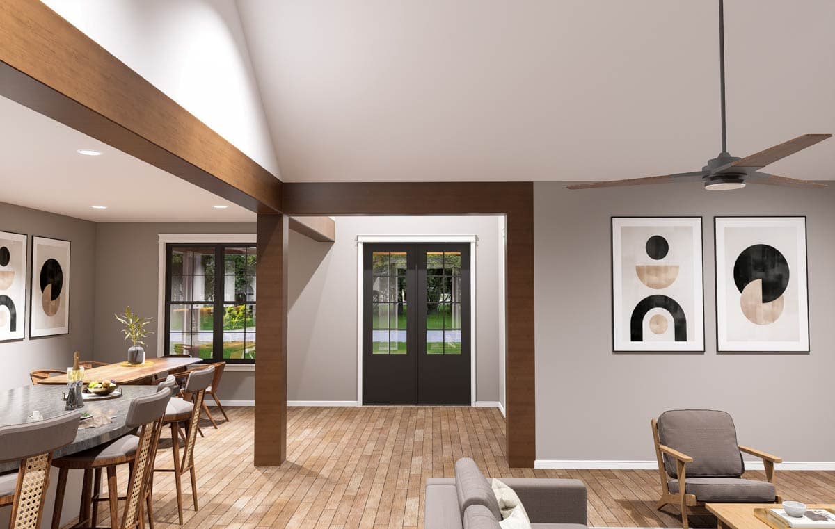 Interior rendering showing a great room with vaulted ceiling, exposed wood beams, island seating, and double doors.