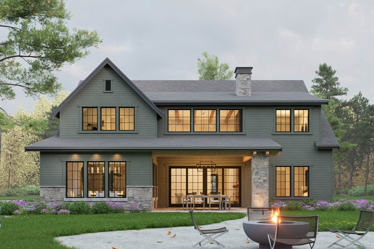 Modern Farmhouse house plan exterior with stone accents, large gabled dormer, and covered patio.