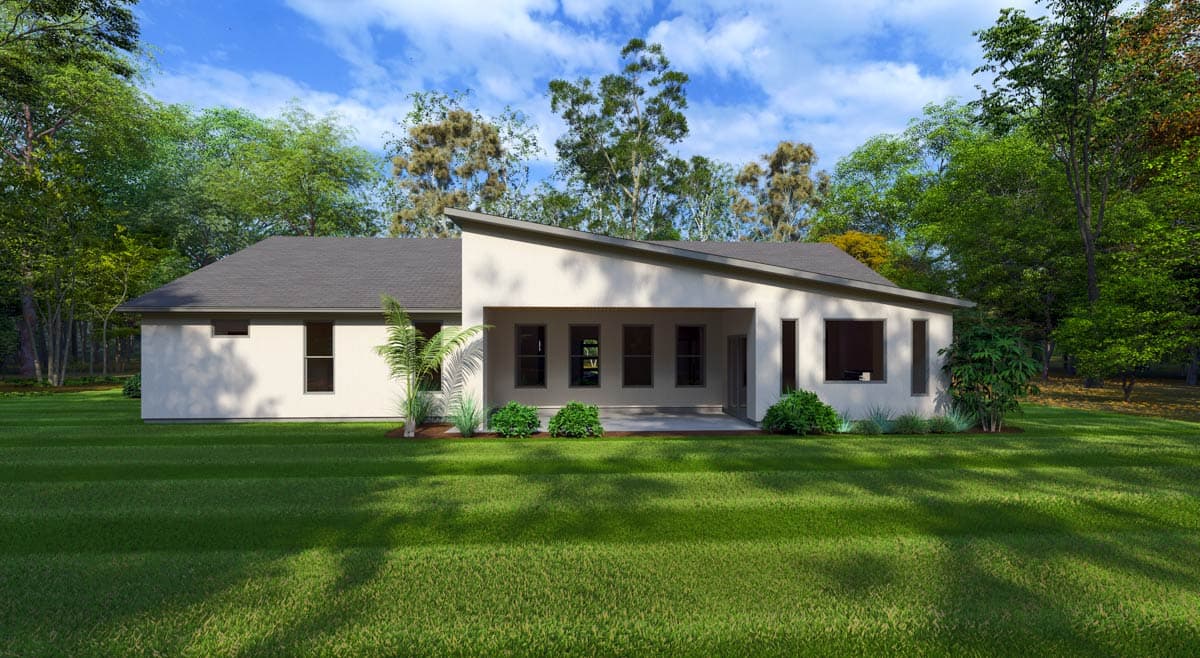 Modern ranch house plan exterior with a sloped roofline, covered patio with multiple windows, and stucco finish.