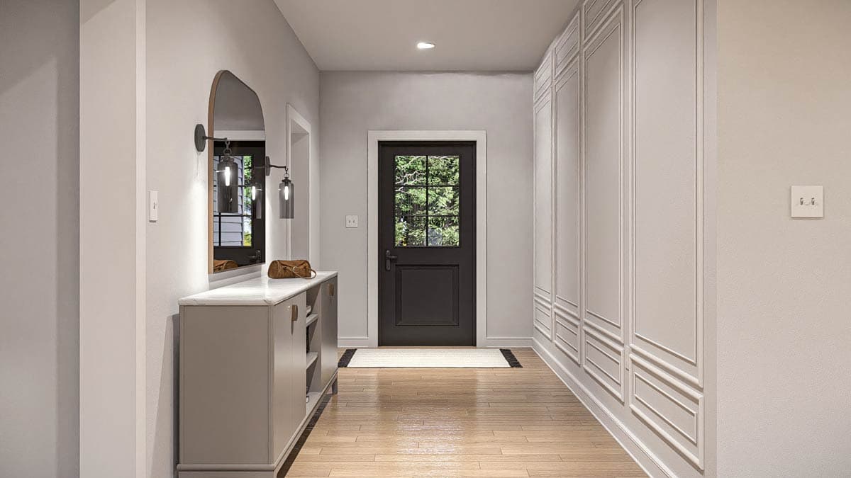 Entryway with dark wood door, console table, arched mirror, and paneled walls.