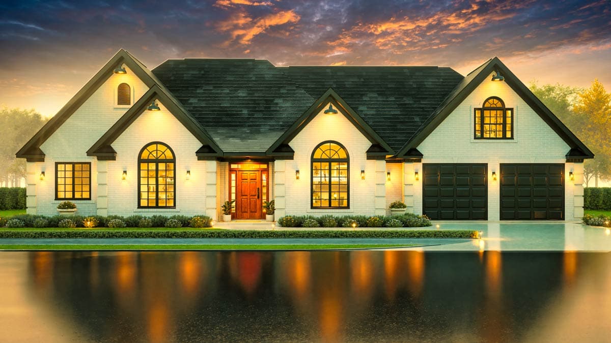 House plan exterior: one-story home with white brick, prominent gables, arched windows, and a three-car garage.