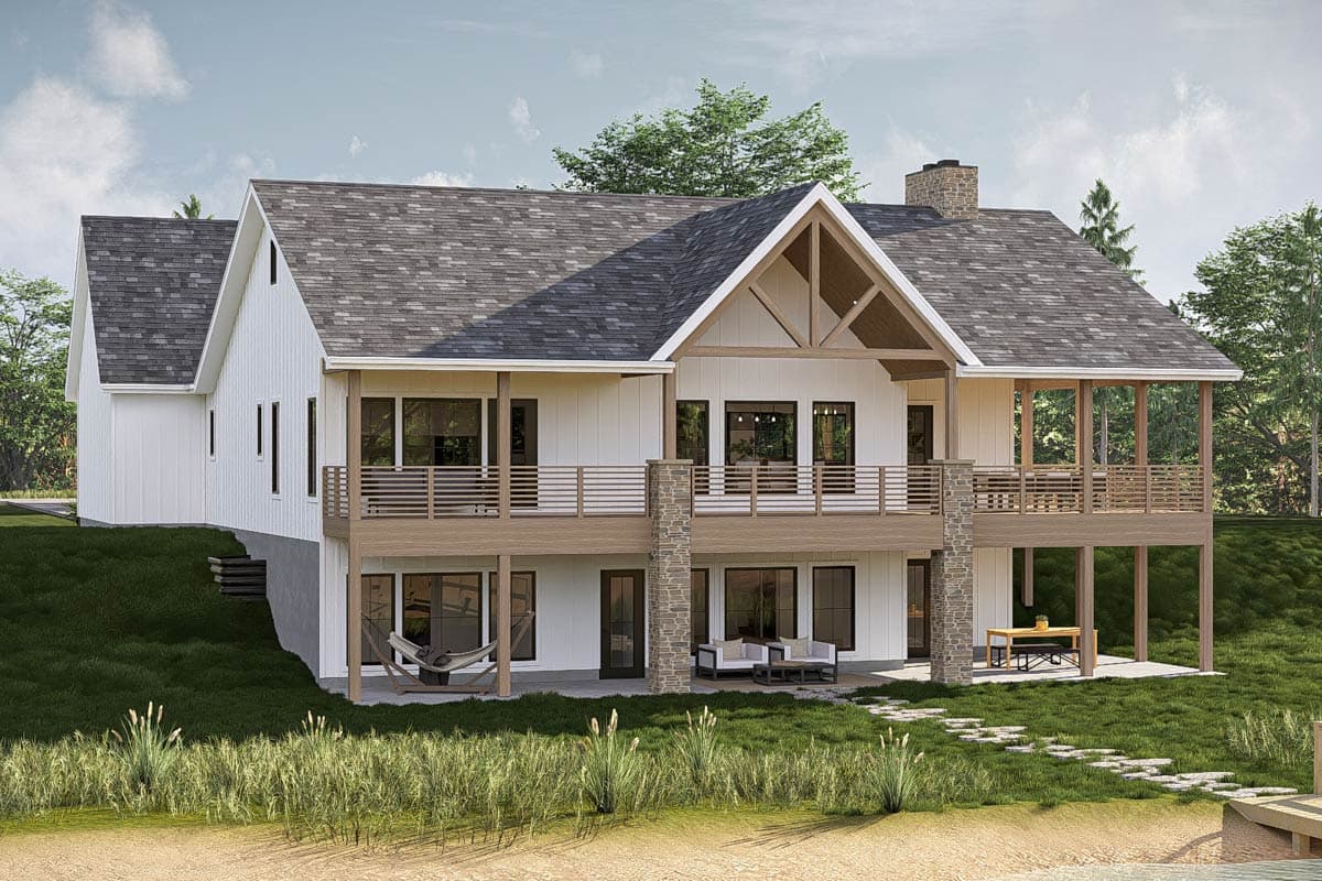 Modern Farmhouse house plan exterior, two stories, wide wrap-around deck, gable with exposed beams, stone accents.