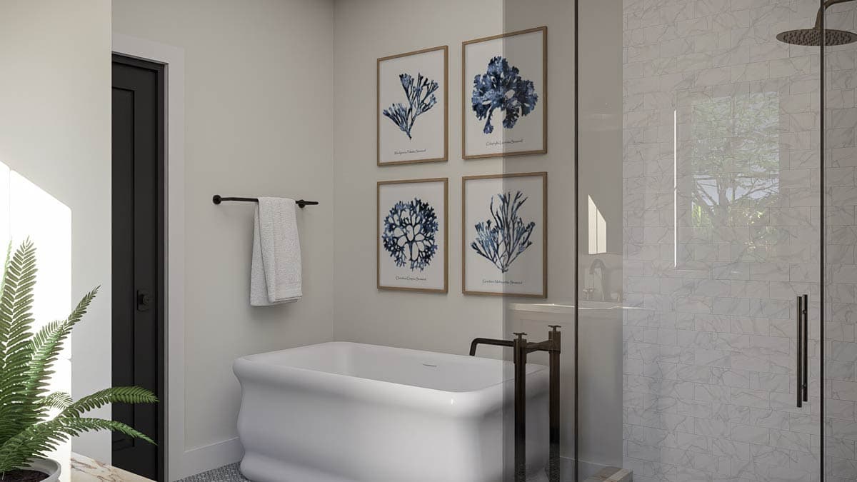 Modern bathroom with freestanding tub, glass-enclosed shower with marble tile, and botanical prints.