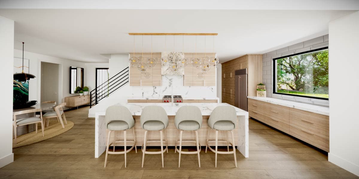 Modern kitchen design with a large island, wood cabinets, marble countertops, and a window overlooking a lush tree.