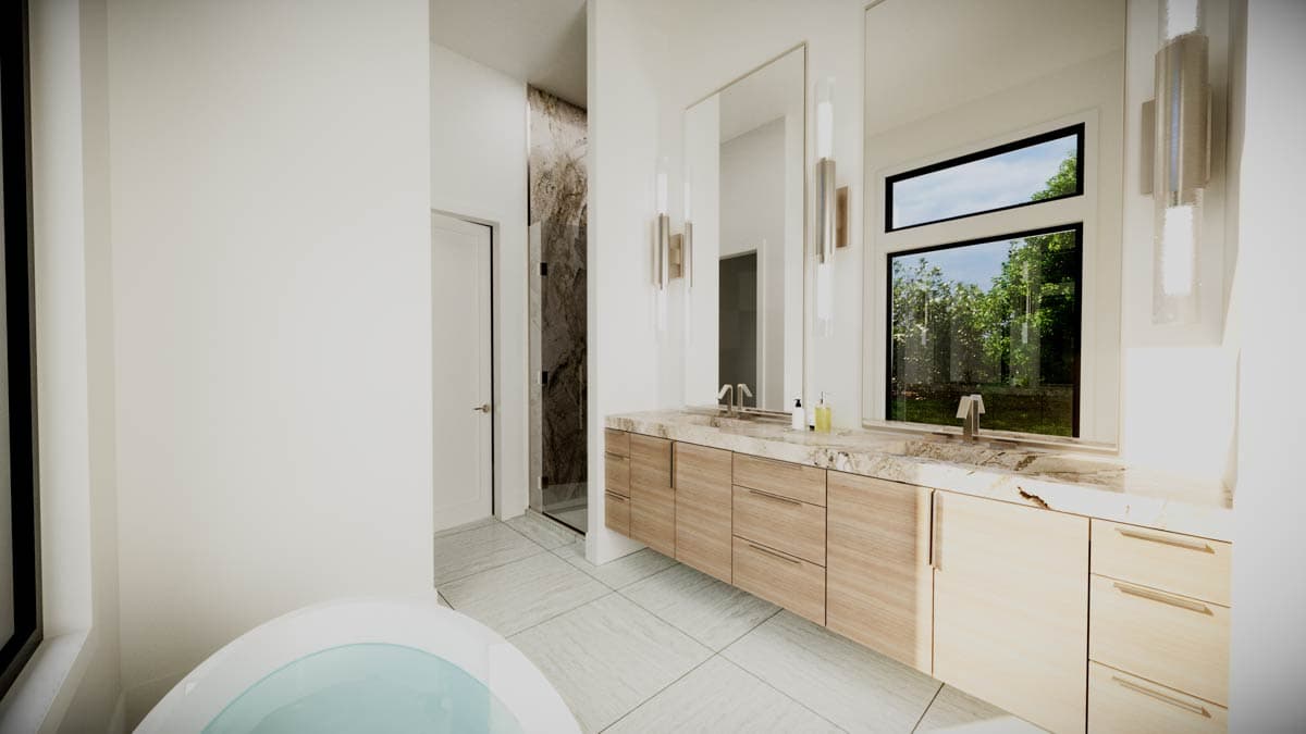 Modern master bathroom with double vanity, large mirror, and window with outdoor view. Features light wood cabinetry.