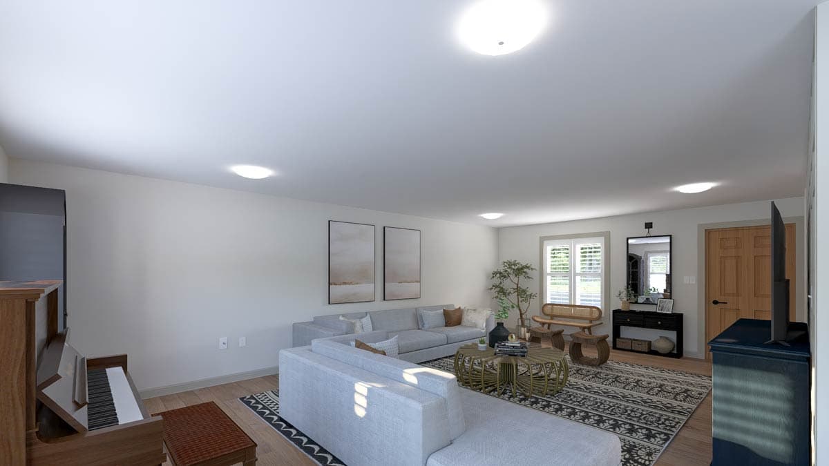Interior rendering of a great room with sectional sofa, coffee table, piano, and entertainment center.