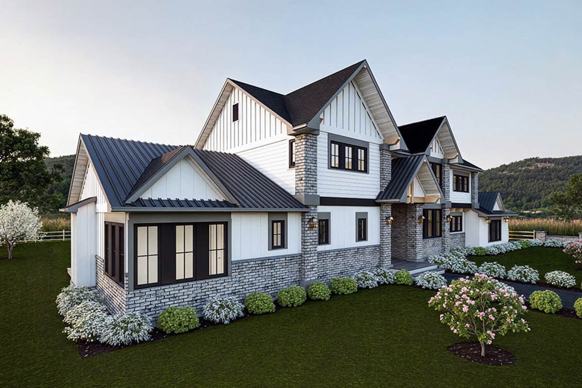 Modern Farmhouse house plan exterior with white board and batten siding, stone accents, and dark metal gable roofs.