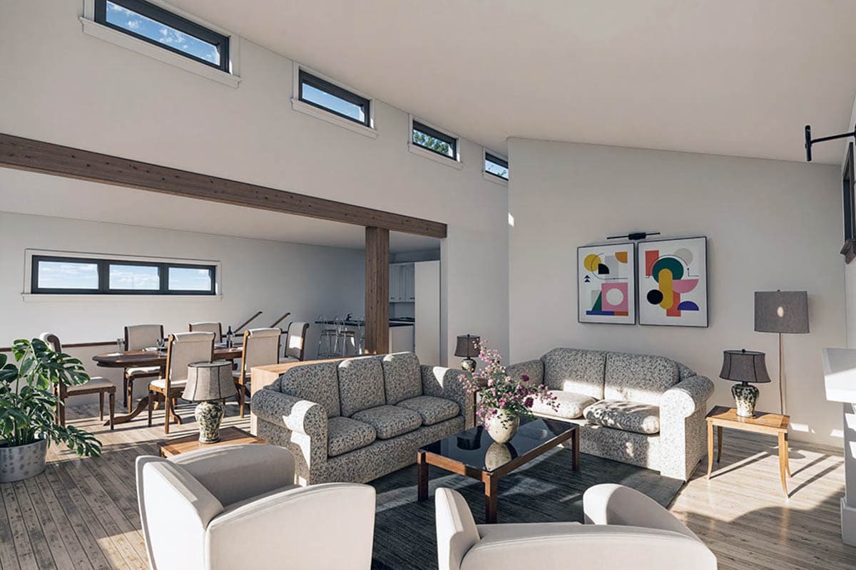 Open-plan living and dining area with vaulted ceiling, exposed beams, and clerestory windows.