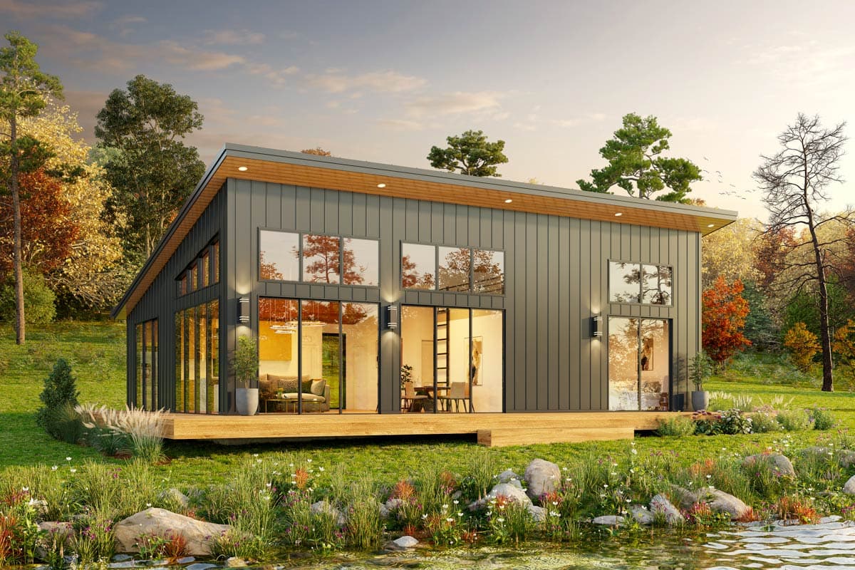 Modern house plan exterior with metal siding, large windows, a sloped roof, and a wooden deck.
