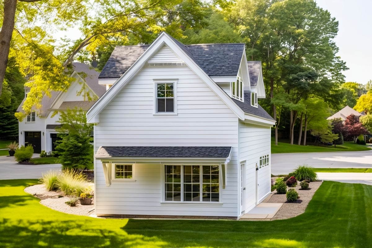 Two-story Modern Farmhouse exterior with gables, dormers, lap siding, and a covered entry.