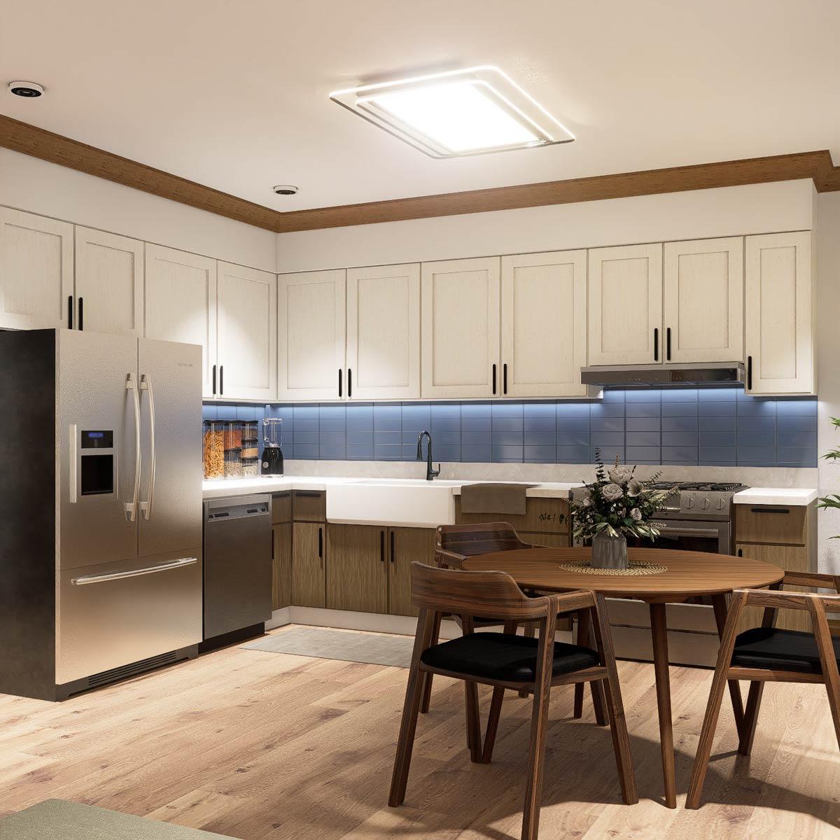 Kitchen with white cabinets, farmhouse sink, stainless steel appliances, blue tile backsplash, and round dining table.