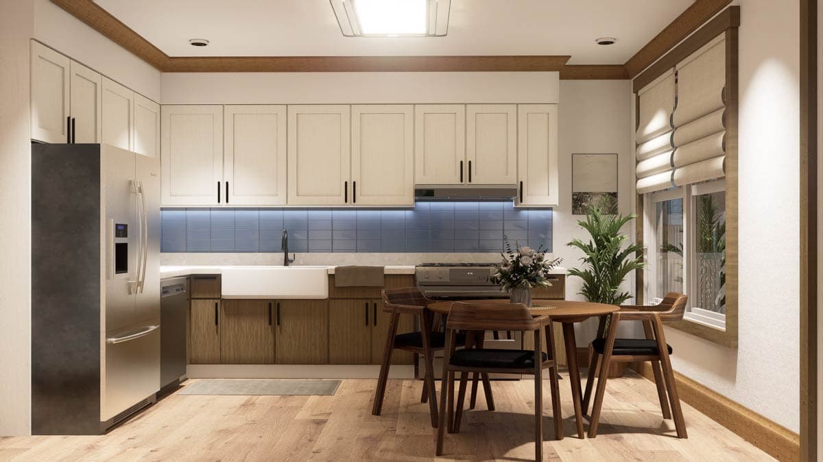 Kitchen with white cabinets, blue tile backsplash, farmhouse sink, stainless steel refrigerator, and a small dining area.