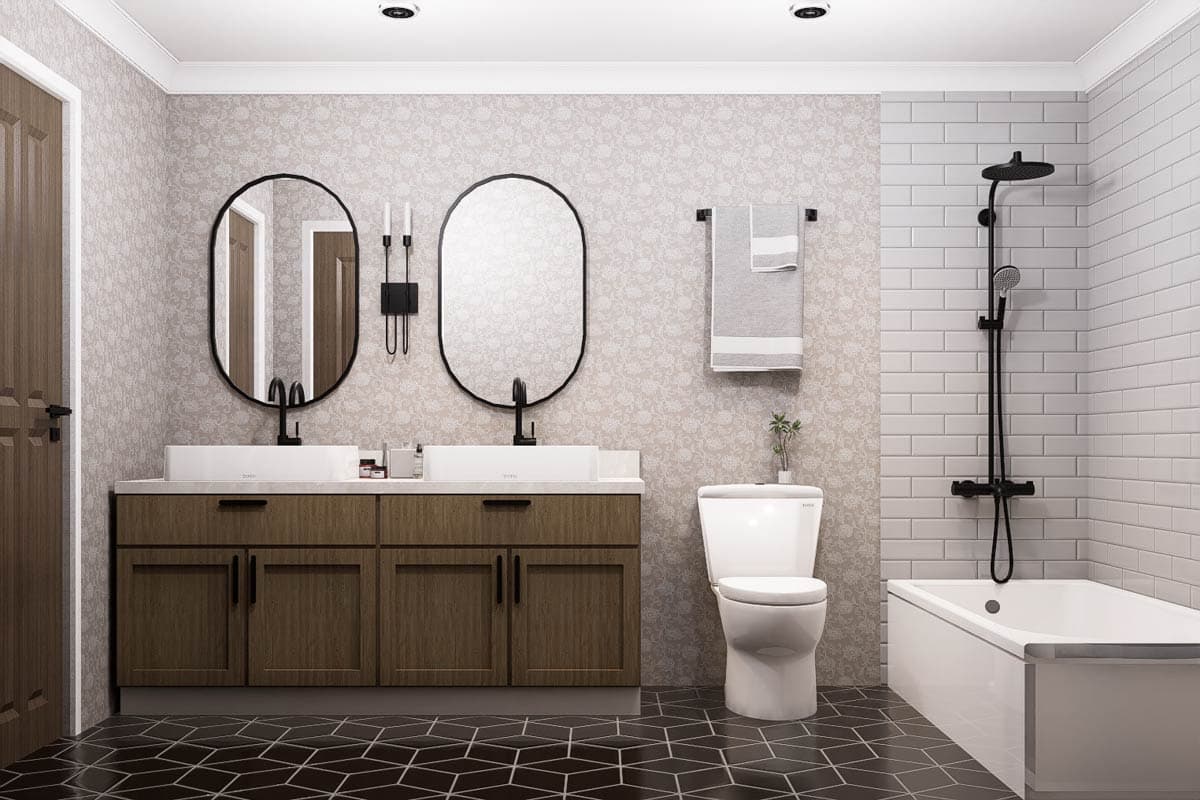Bathroom interior with double vanity, vessel sinks, toilet, and bathtub with black fixtures and subway tile shower surround.