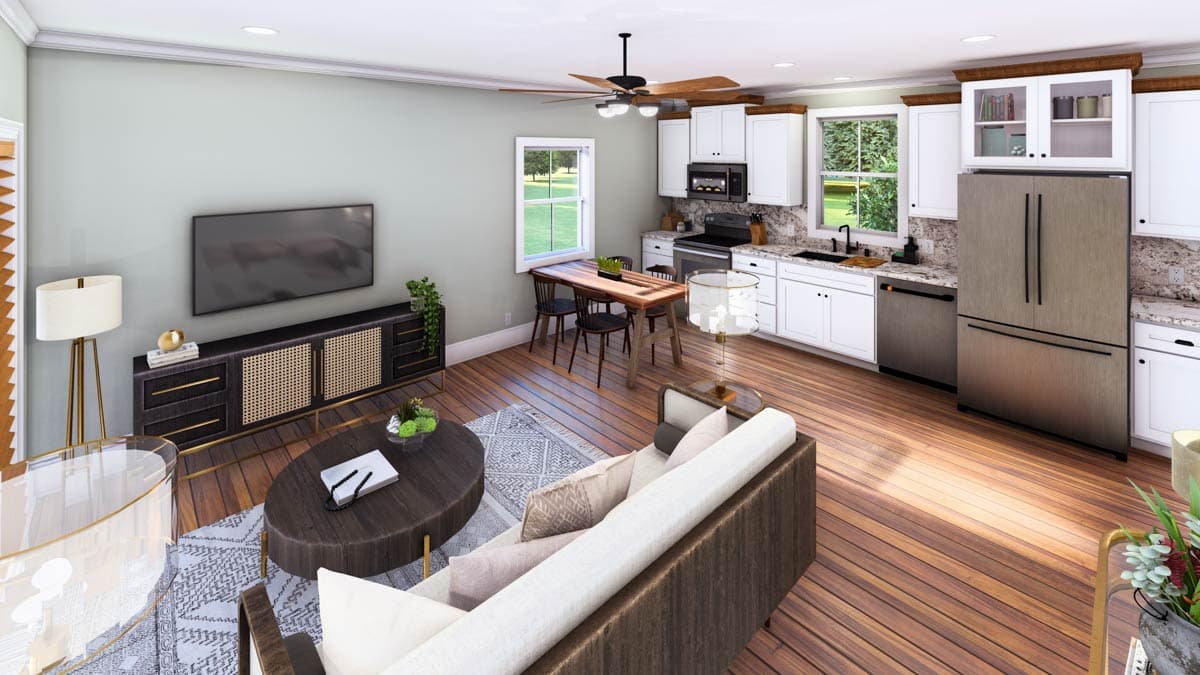 Open concept living and kitchen area with white cabinets, granite countertops, stainless steel appliances, and dining table.