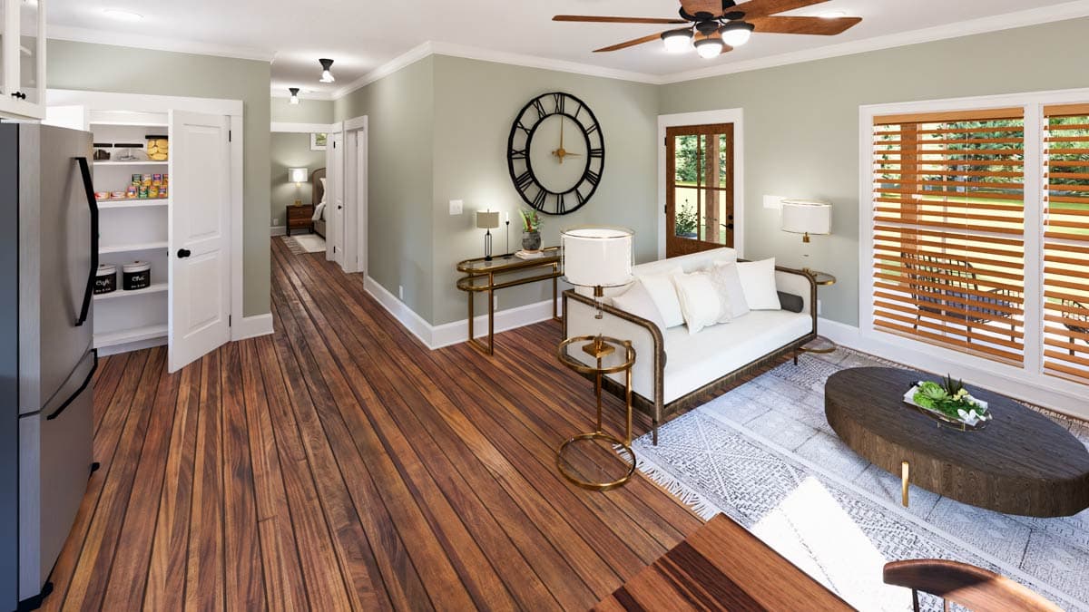 Interior rendering showing a living area with a couch, coffee table, pantry, and hallway leading to a bedroom.
