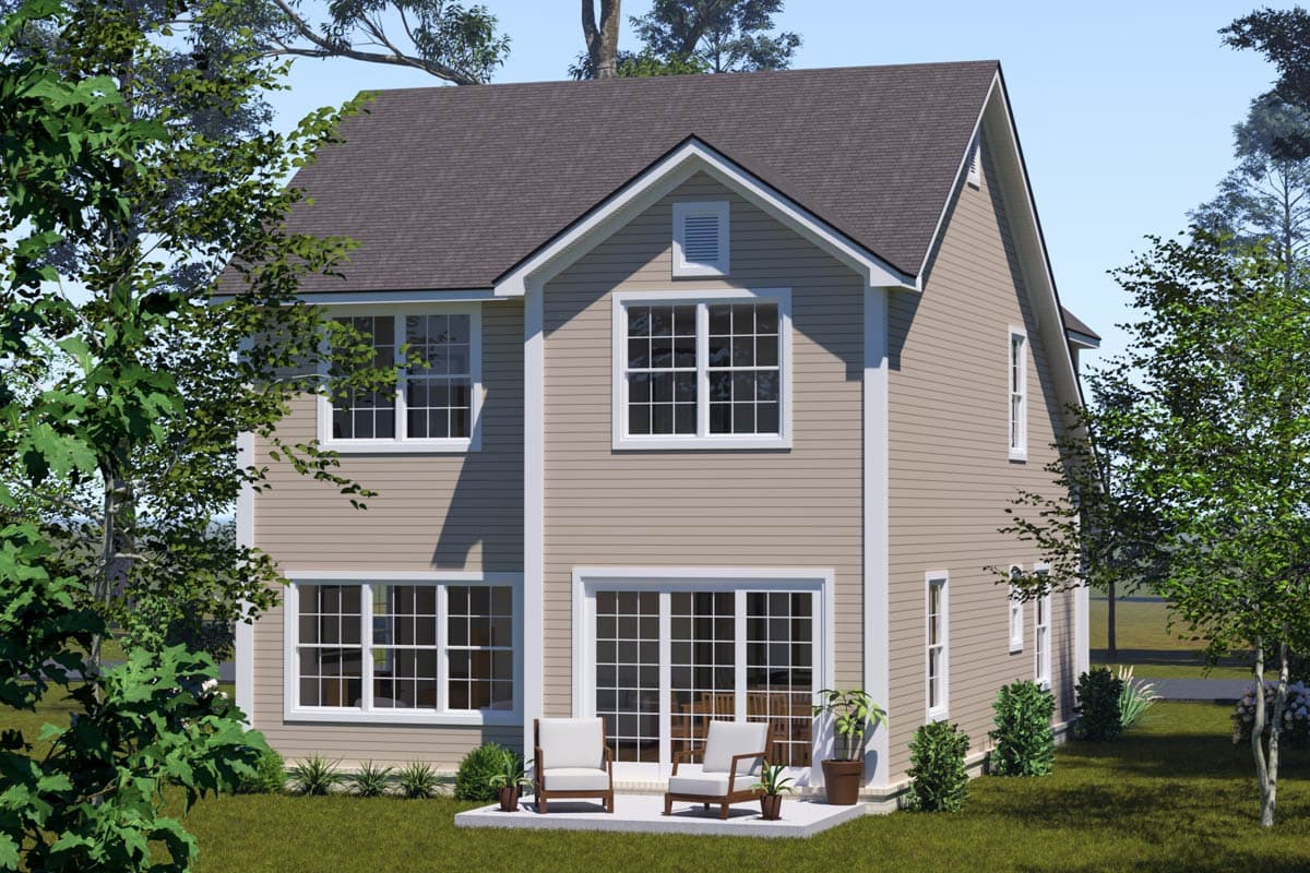 Two-story house plan exterior with gabled dormer, multiple windows, and a patio with seating.