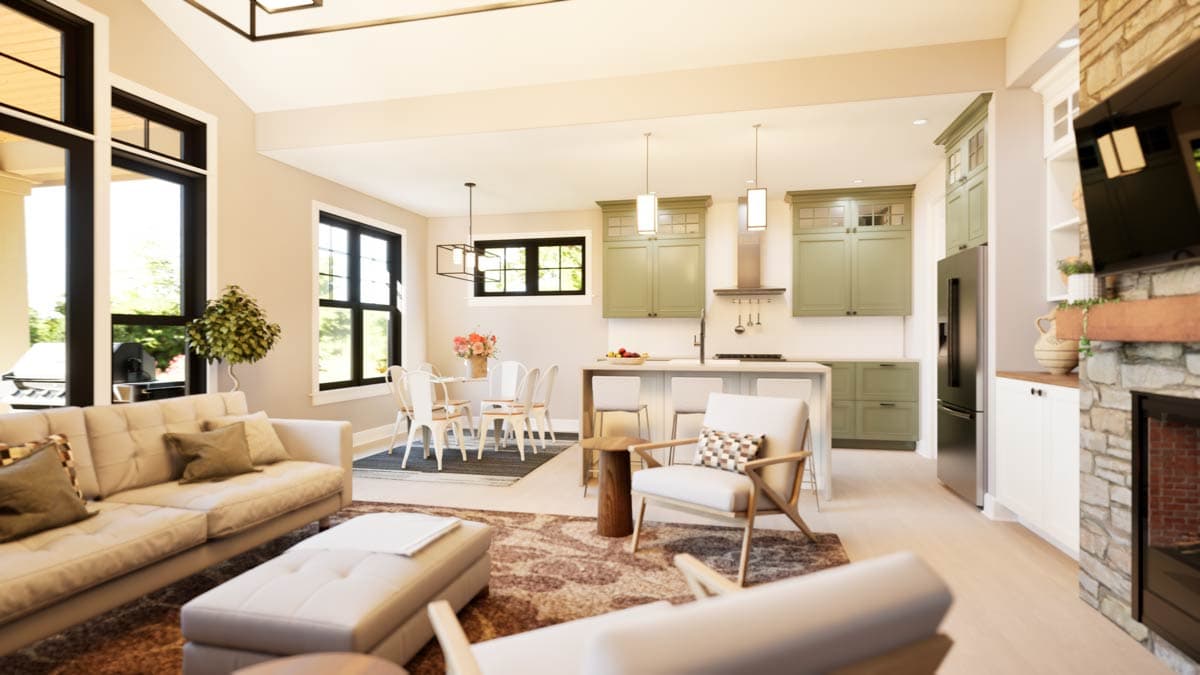 Open concept living area with vaulted ceiling, kitchen island, dining area, fireplace, and large windows.