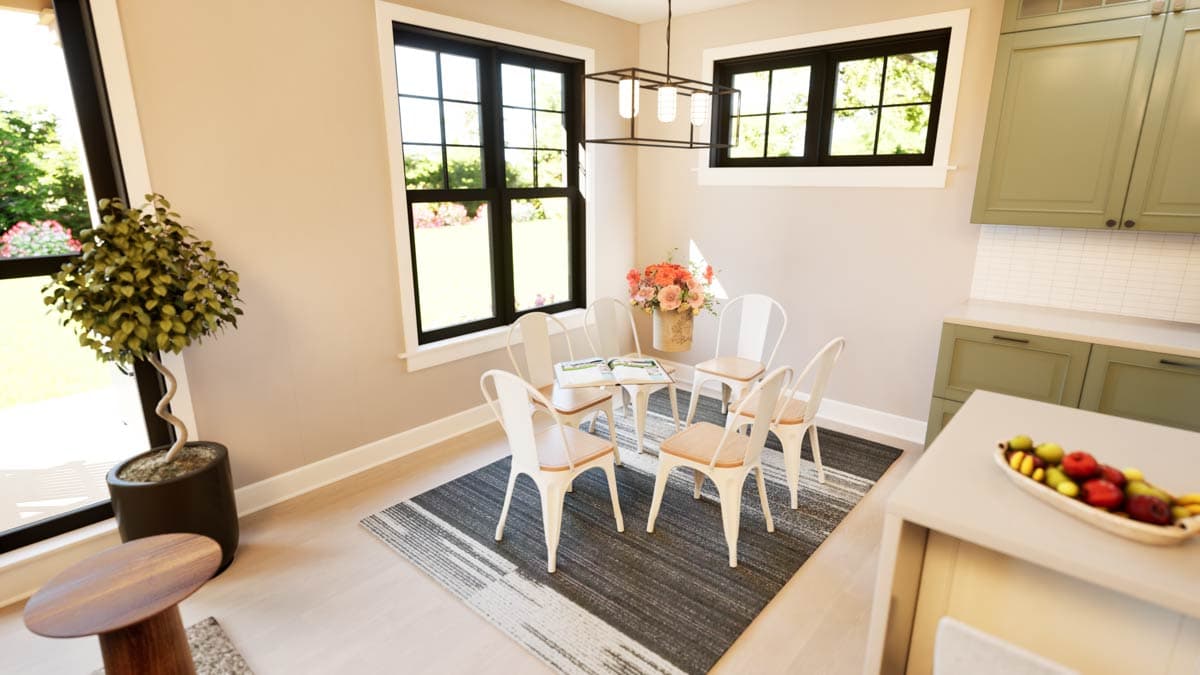 Dining area with six chairs around a table, featuring large windows and adjacent kitchen cabinetry.