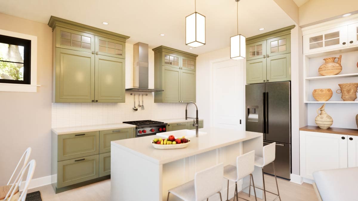 Kitchen interior with sage green cabinets, white subway tile backsplash, island with sink, stainless steel appliances, and bar stools.