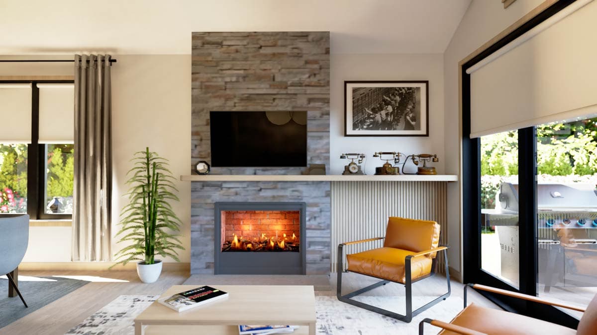 Living room with stone fireplace, mounted TV, and large window opening to an outdoor grill area.