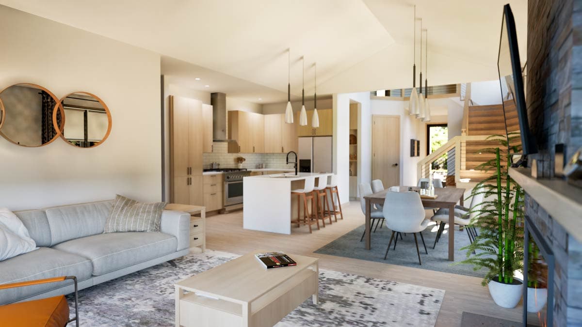 Open concept living area with kitchen island, dining table, and fireplace.