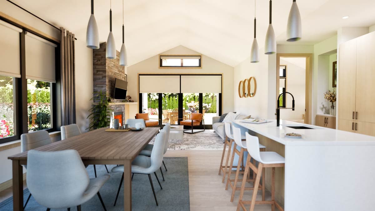 Open concept living space featuring a dining area, living room with fireplace, and kitchen island with seating.
