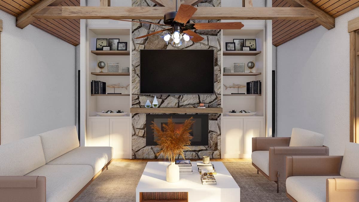 Great room interior design with stone fireplace, vaulted wood beam ceiling, built-in shelving, and seating.