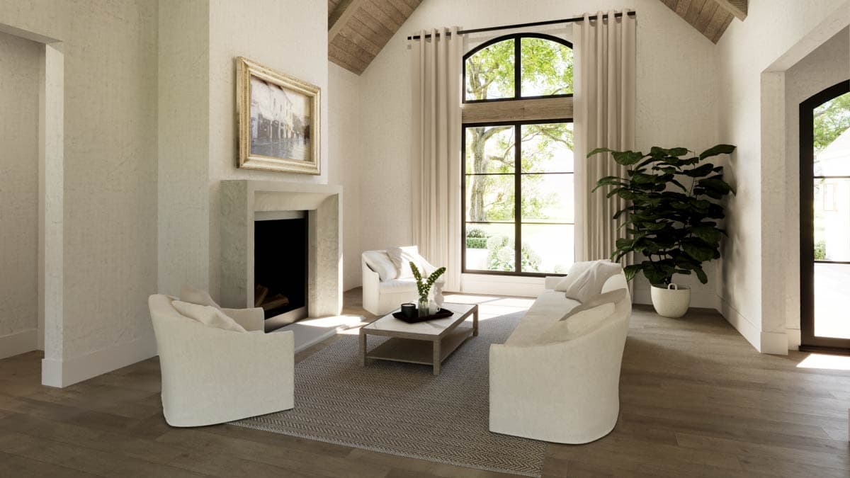 Elegant living room with fireplace, arched window, cream furniture, and a large plant. Neutral tones with natural light.