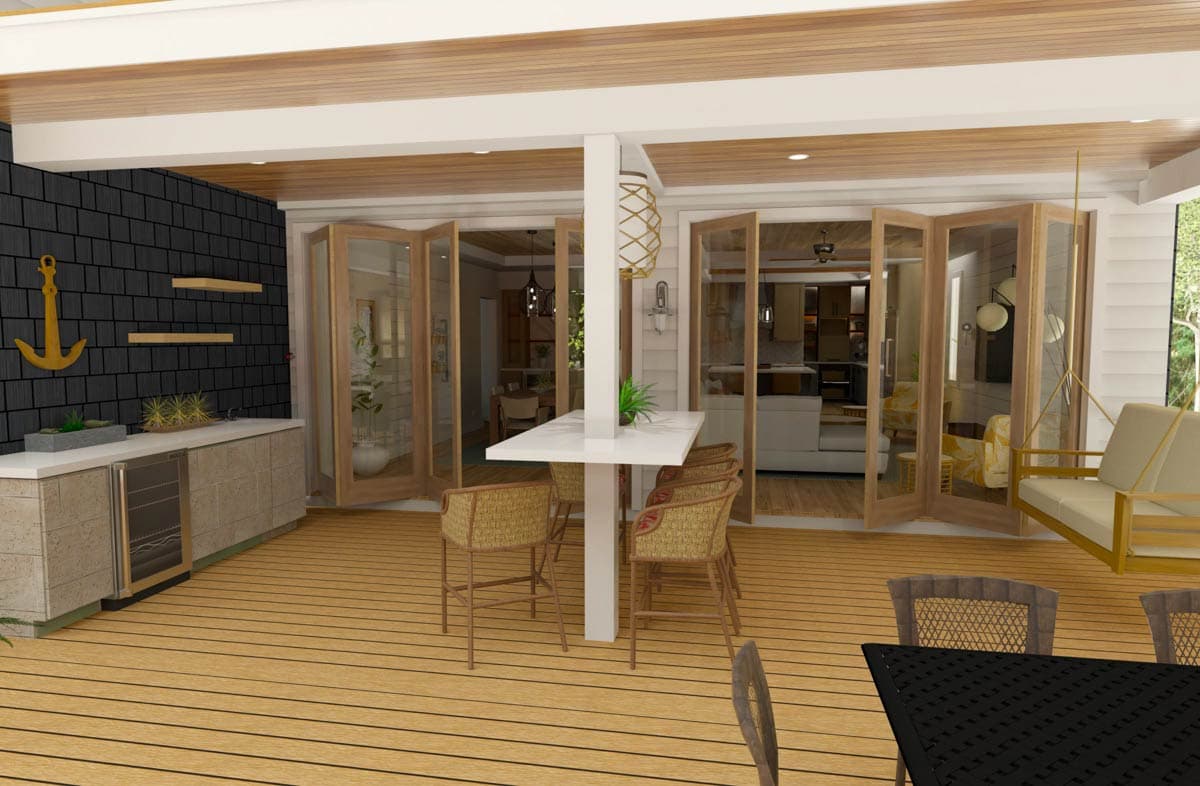 Outdoor living space with bar, folding doors opening to interior, and seating.