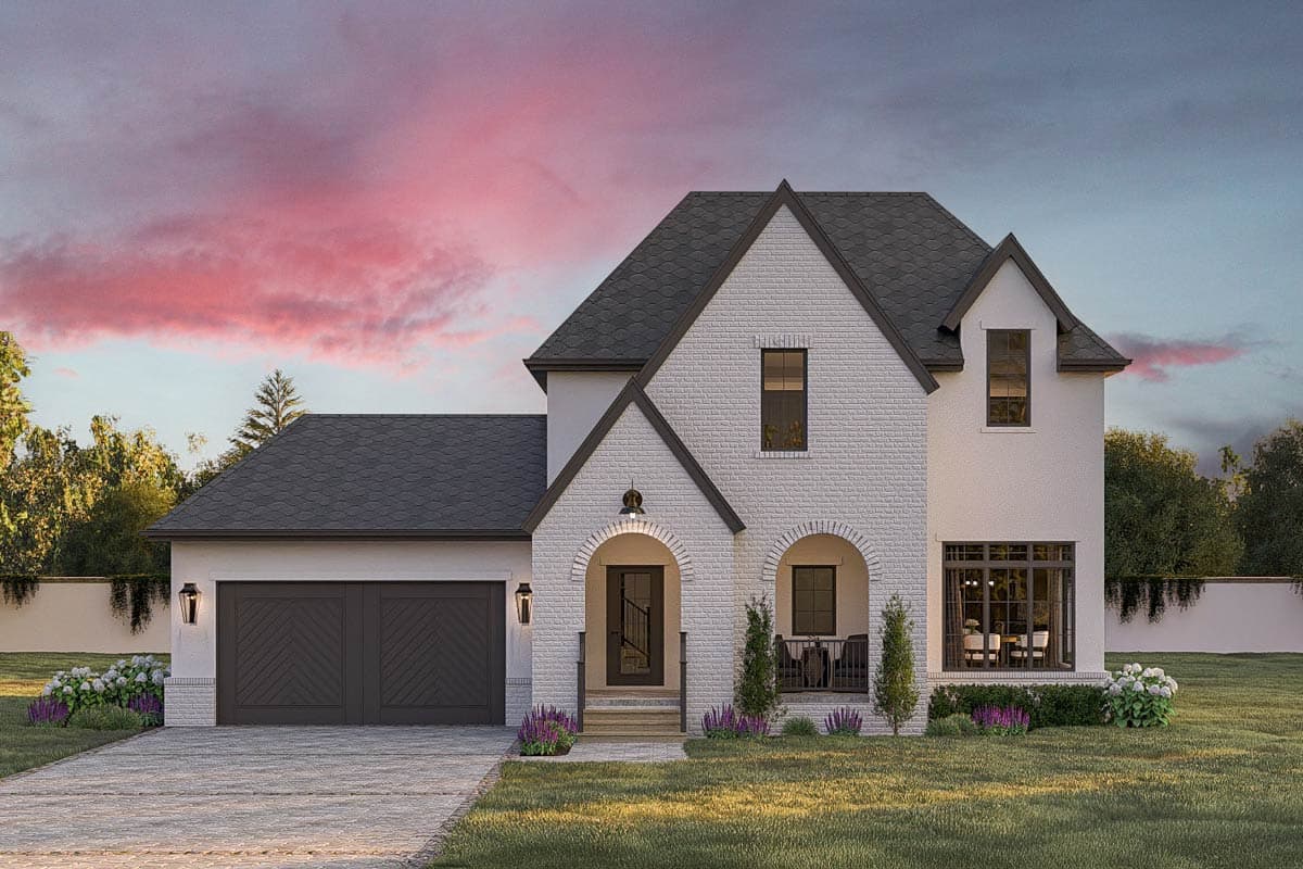 House plan exterior featuring a two-story design with a gabled roof, brick facade, and arched entry porch. Includes a two-car garage.