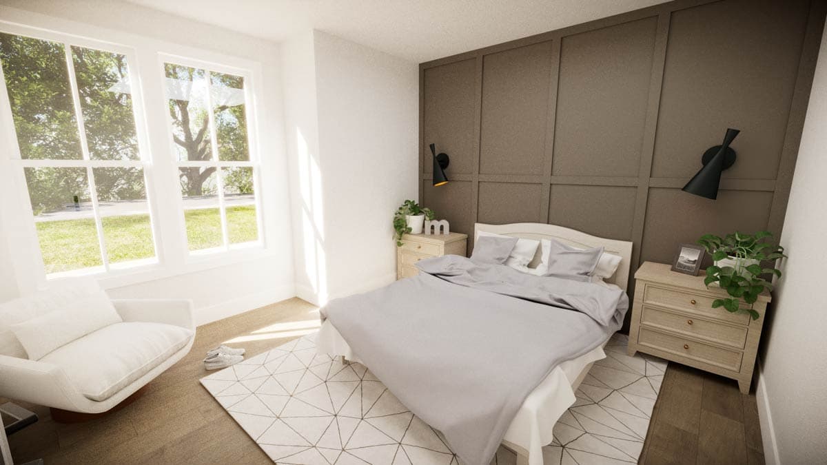 Bedroom with large windows, bed with gray bedding, bedside tables, wall-mounted lamps, and a white chair.