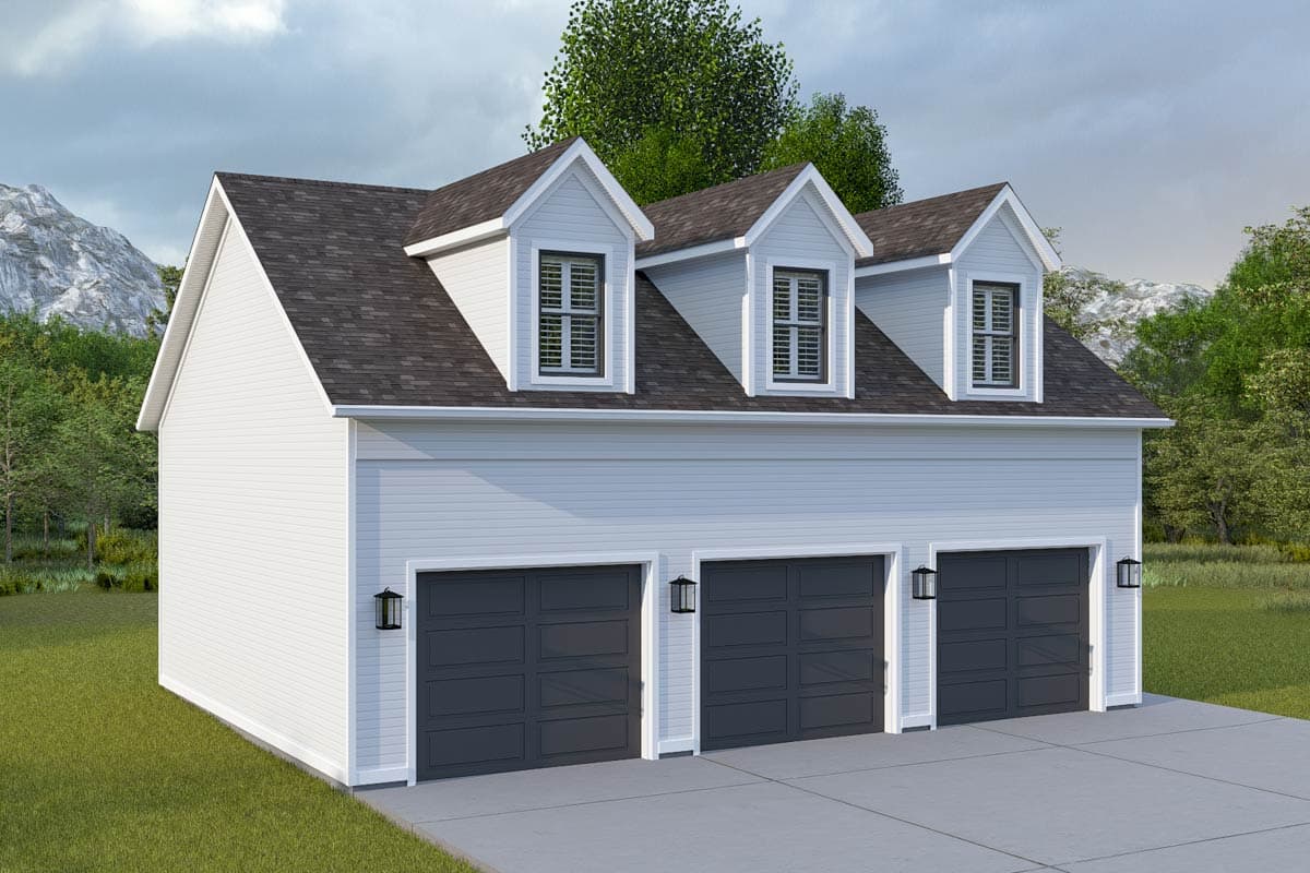 Three-car garage exterior with three gabled dormers and dark gray panel garage doors.